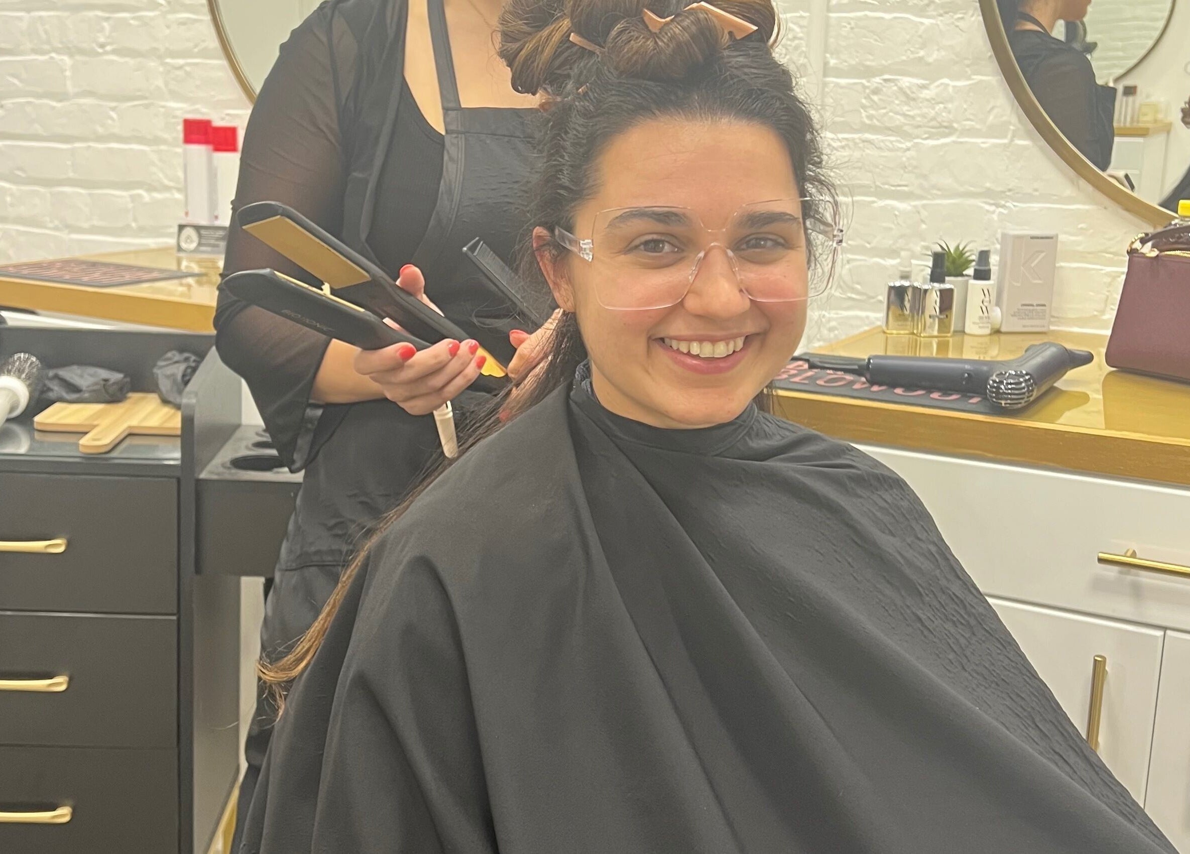 Client enjoying a styling session at Eversaint Salon, New Orleans, Louisiana, US.