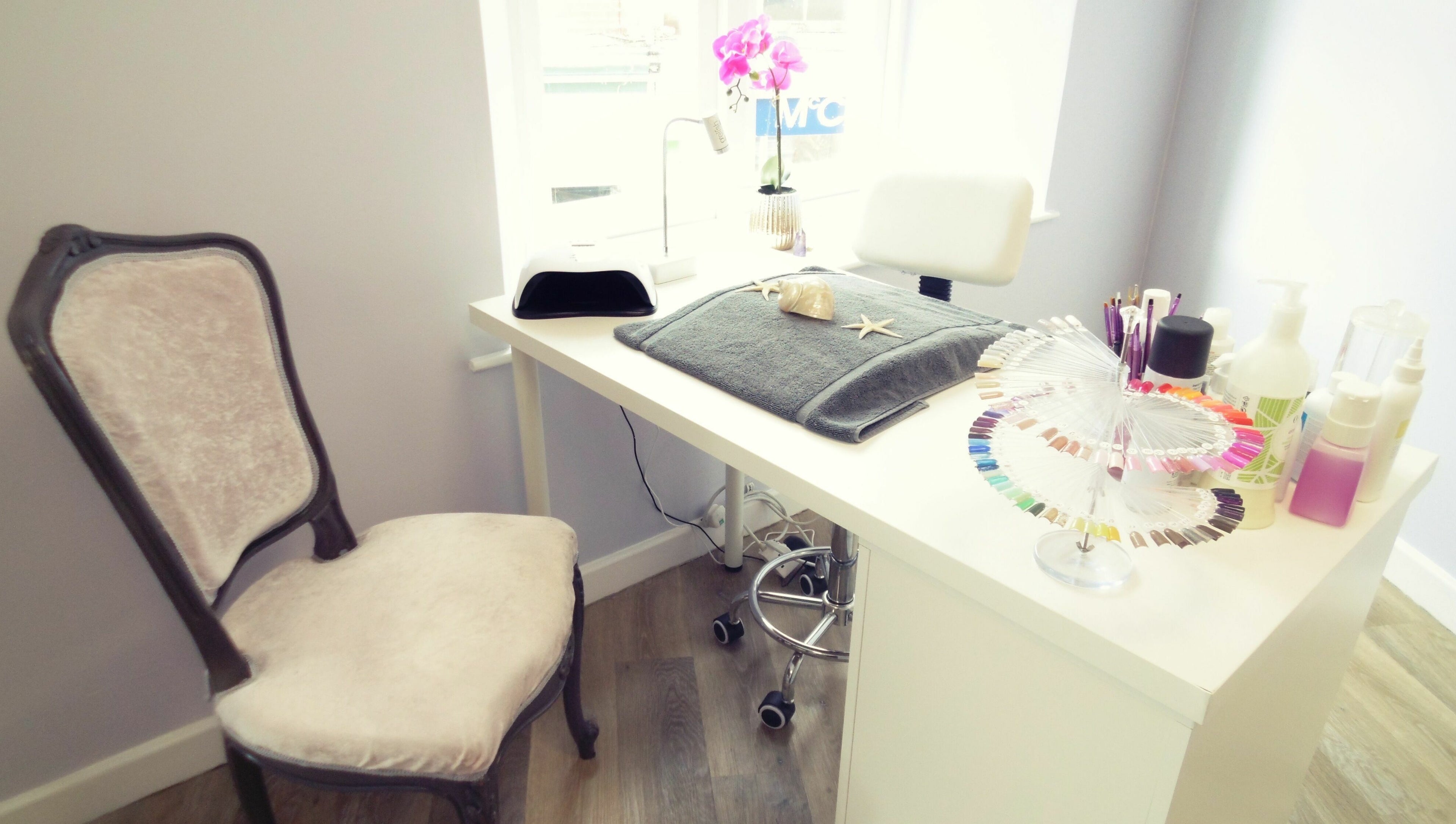 Chic nail station at Serenity On The Square in Holsworthy, England, GB, adorned with manicure tools and polish.