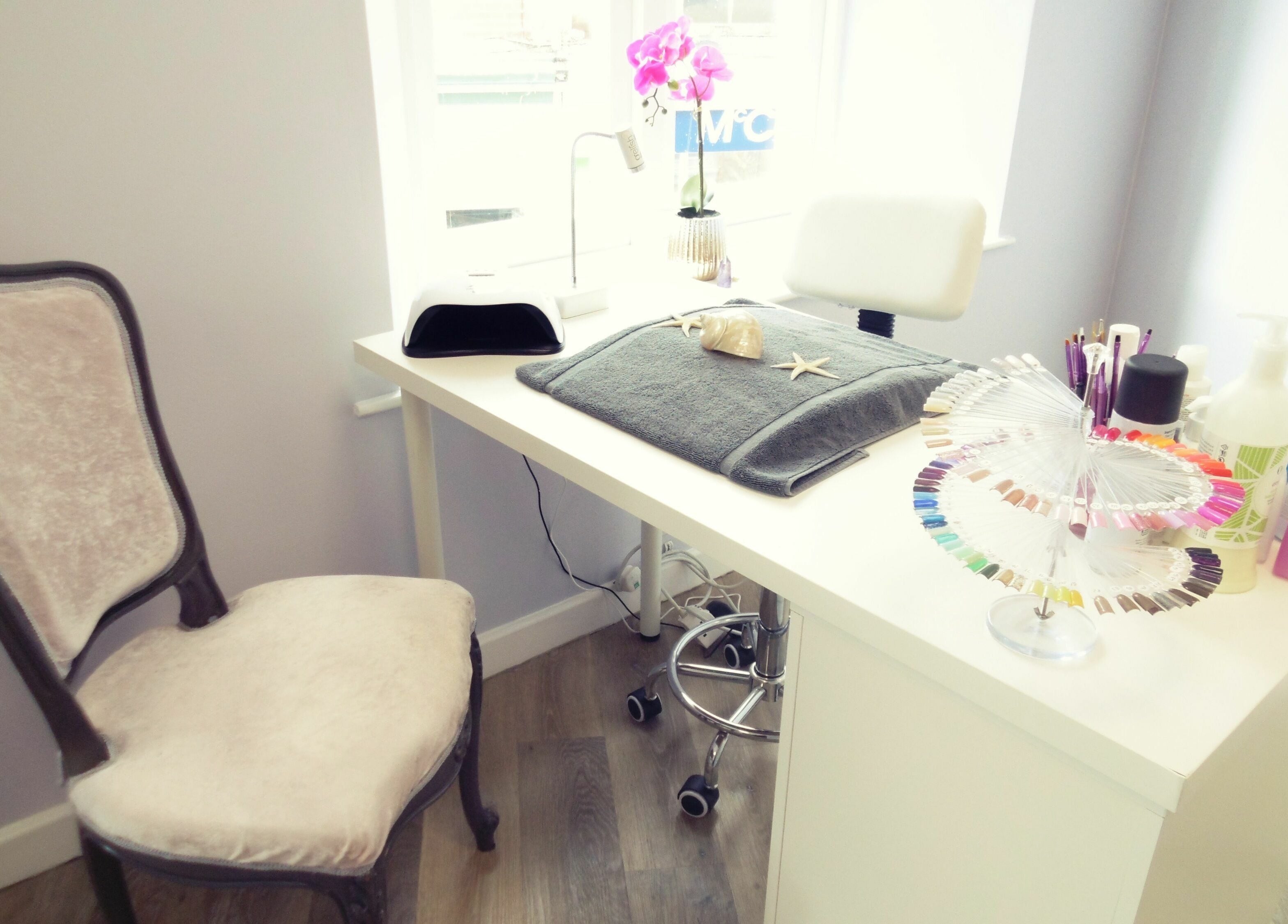 Chic nail station at Serenity On The Square in Holsworthy, England, GB, adorned with manicure tools and polish.