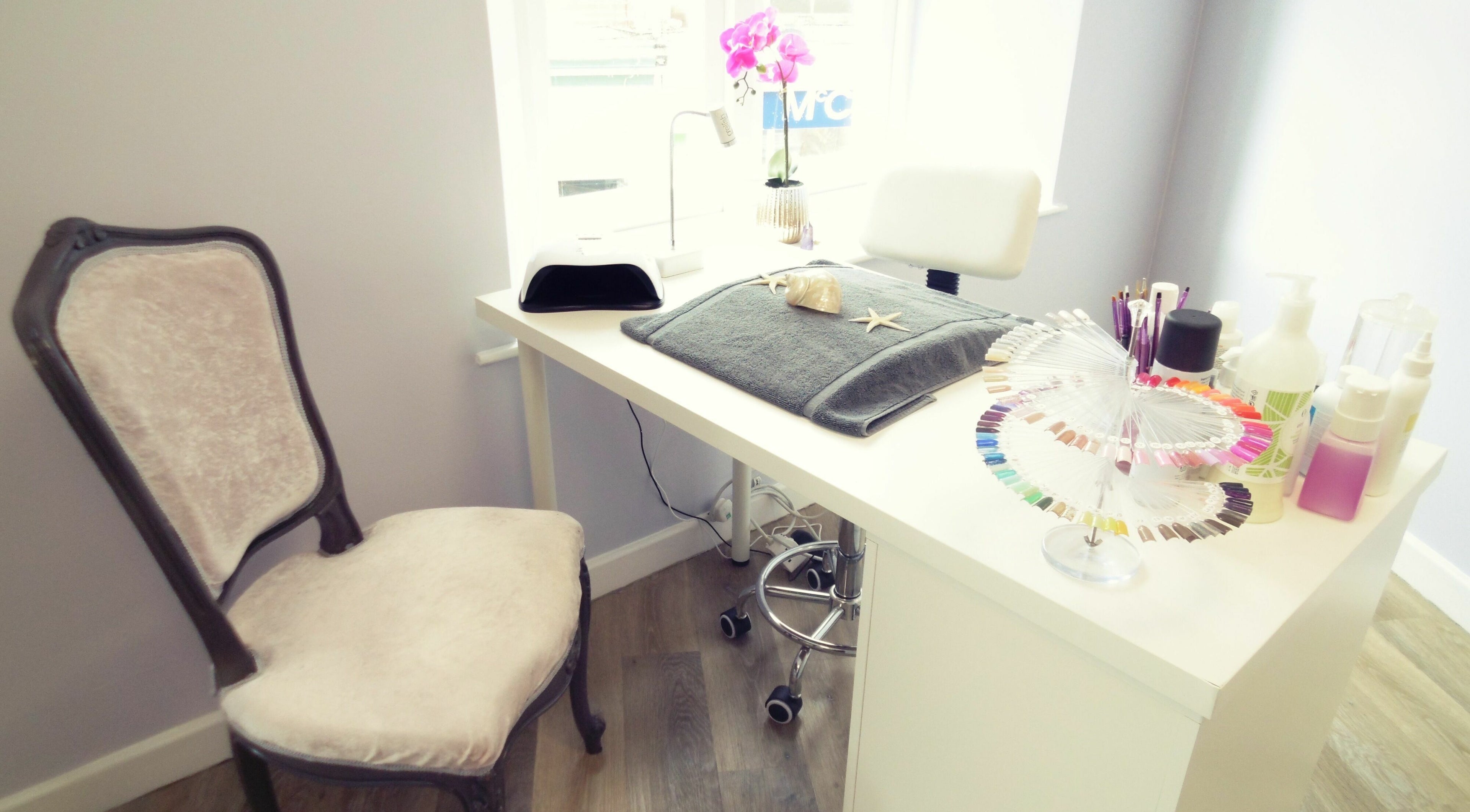 Chic nail station at Serenity On The Square in Holsworthy, England, GB, adorned with manicure tools and polish.