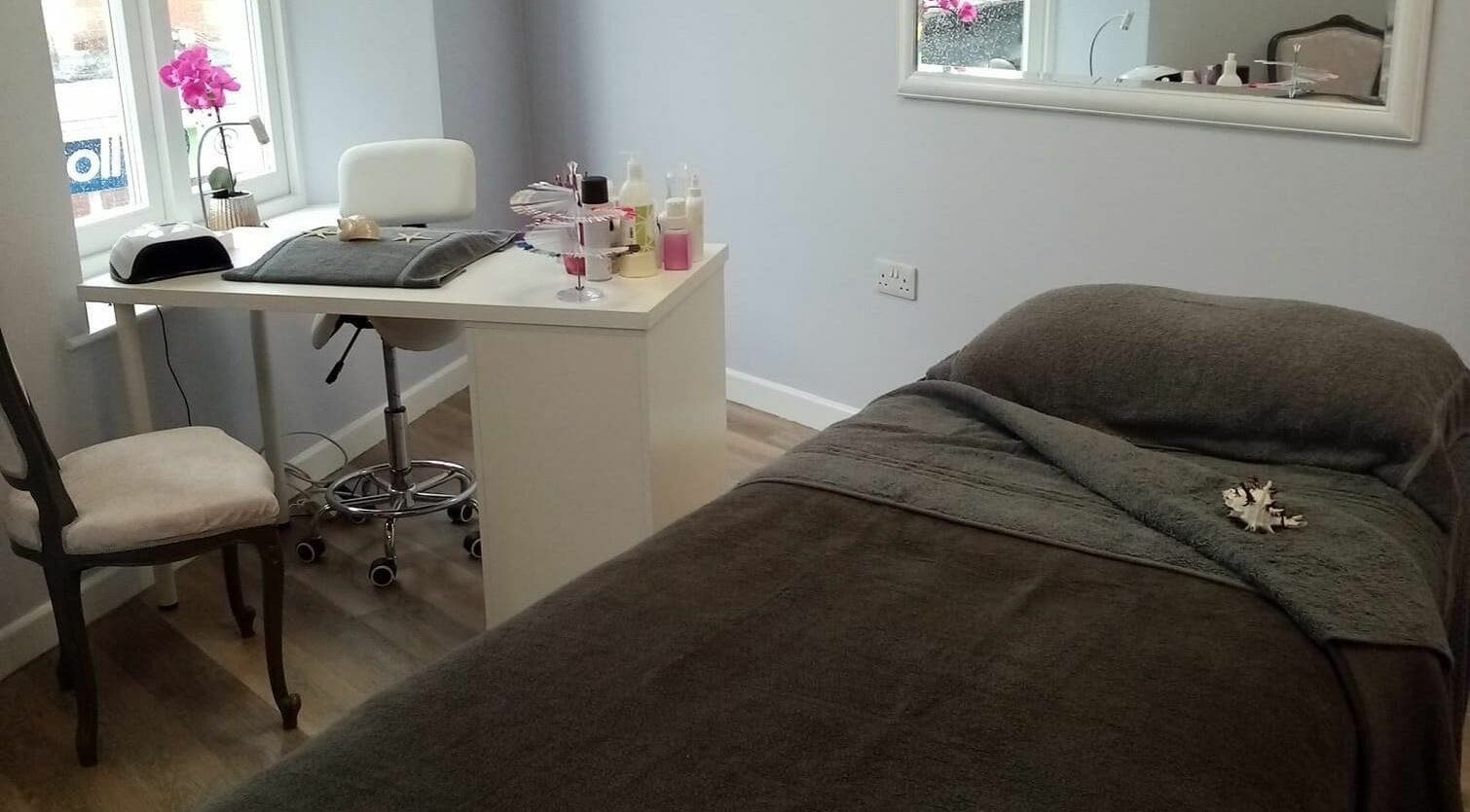 Treatment room at Serenity On The Square, Holsworthy, England, GB with relaxing decor and massage bed.