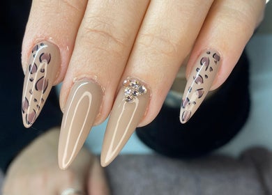 Elegant leopard print and gem-adorned nails at Polish'd Nails in Sandgate, Queensland, AU.