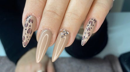 Elegant leopard print and gem-adorned nails at Polish'd Nails in Sandgate, Queensland, AU.