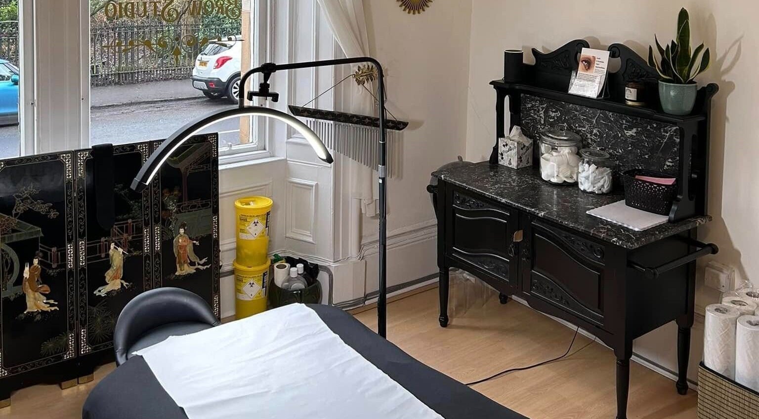 Interior of Miss Highbrow Semi-Permanent Make-up, Lash and Brow Studio in Glasgow, Scotland, featuring a treatment bed.