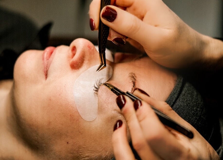 Eyelash extension application at Miss Highbrow Semi-Permanent Make-up, Lash and Brow Studio, Glasgow, Scotland, GB.