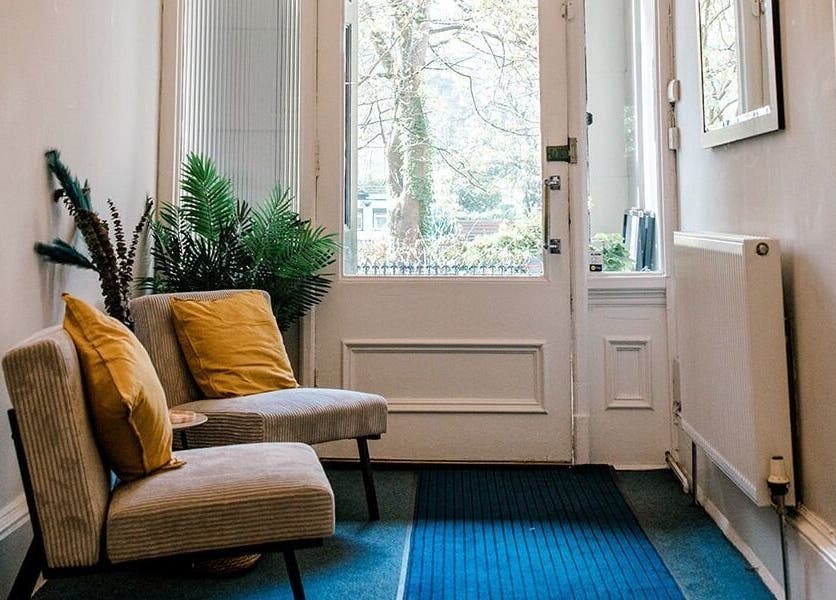 Cozy seating area with plants at Miss Highbrow Semi-Permanent Make-up, Lash and Brow Studio in Glasgow, Scotland, GB.