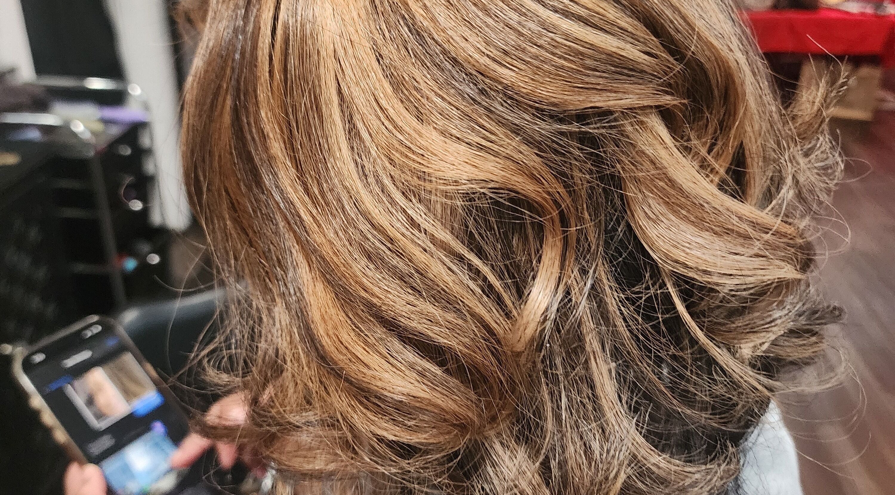 Elegant hairstyle at Shear Luxe Salon, Lake Charles, Louisiana, US showcasing golden highlights.