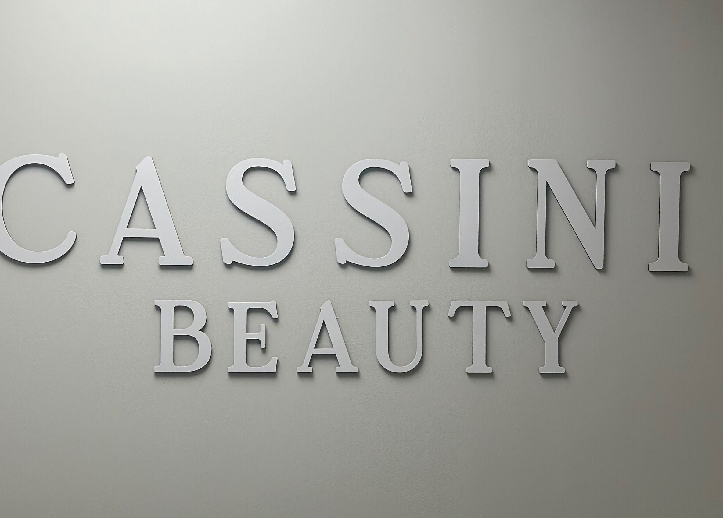 Cassini Beauty by Becci logo on a wall in Stourbridge, England, GB capturing elegant design.