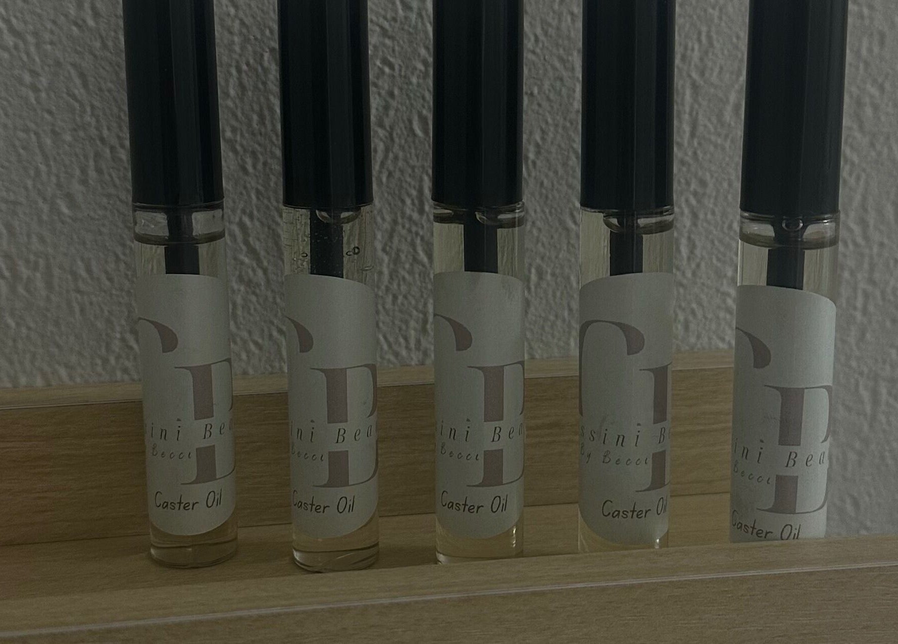 Cassini Beauty by Becci's caster oil bottles displayed on a shelf in Stourbridge, England, GB.