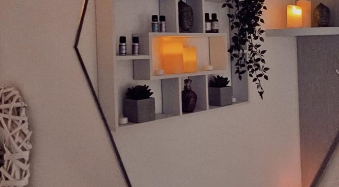 Peaceful candle-lit shelf decor at Cassini Beauty by Becci, Stourbridge, England, GB, enhancing relaxation.
