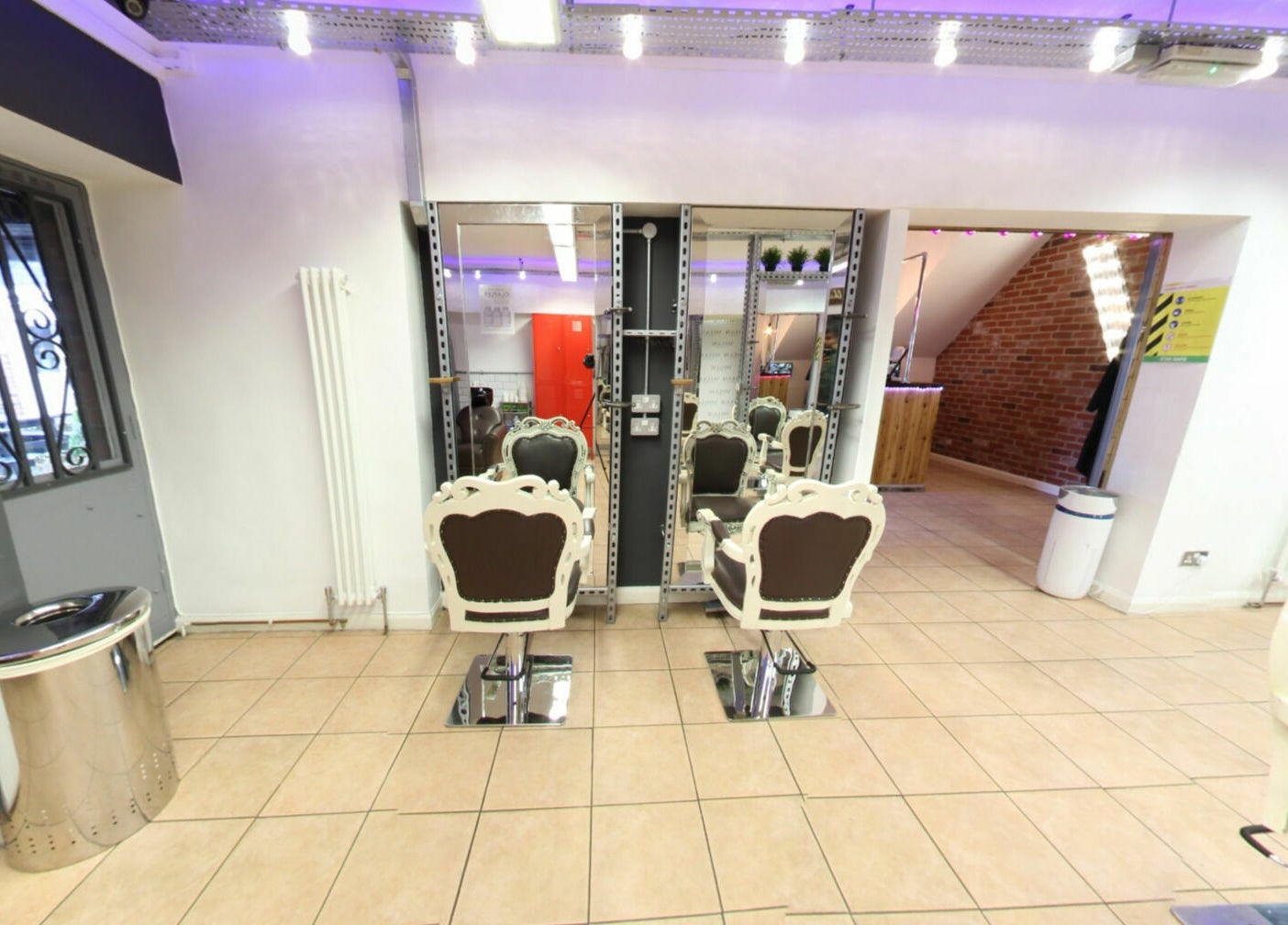 Vo La Si salon with elegant chairs and mirrors in Guisborough, England, GB, creating a chic ambiance.