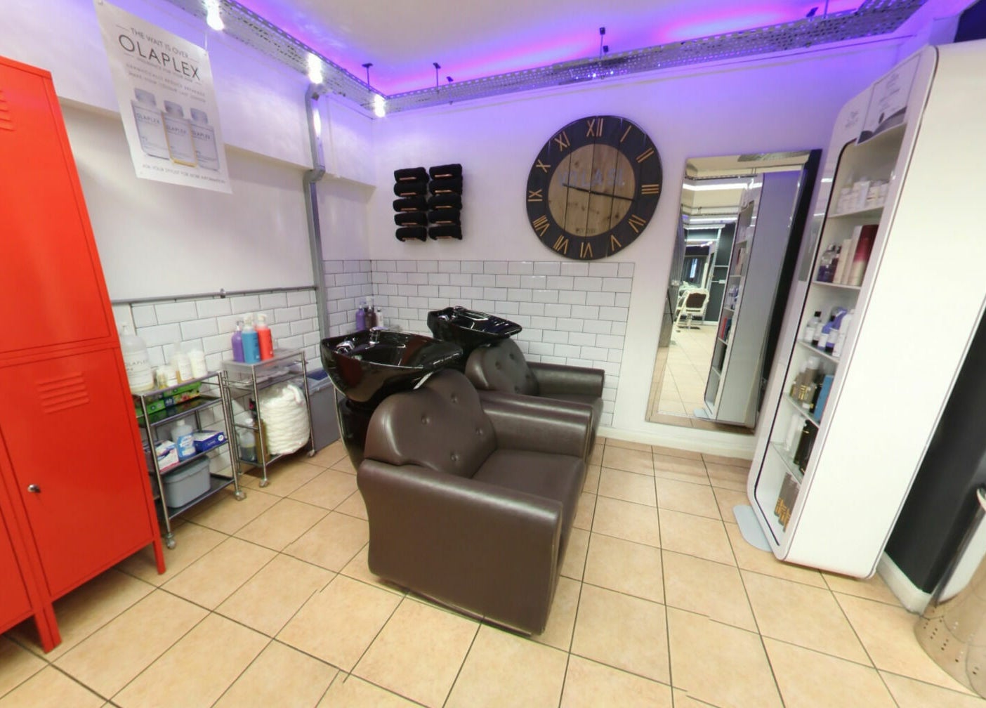 Modern hair washing station at Vo La Si, Guisborough, England, GB with sleek chairs and ambient lighting.