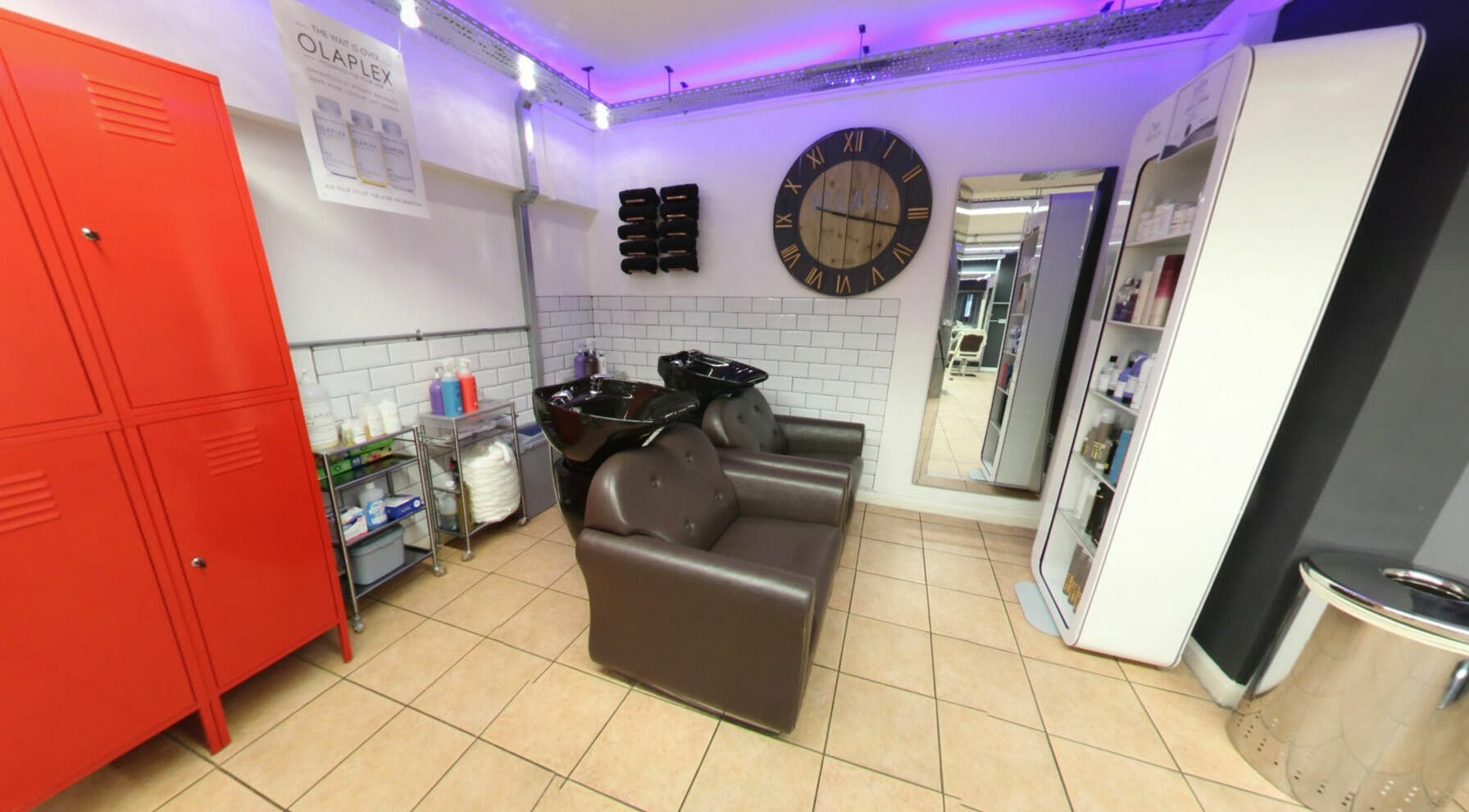 Modern hair washing station at Vo La Si, Guisborough, England, GB with sleek chairs and ambient lighting.