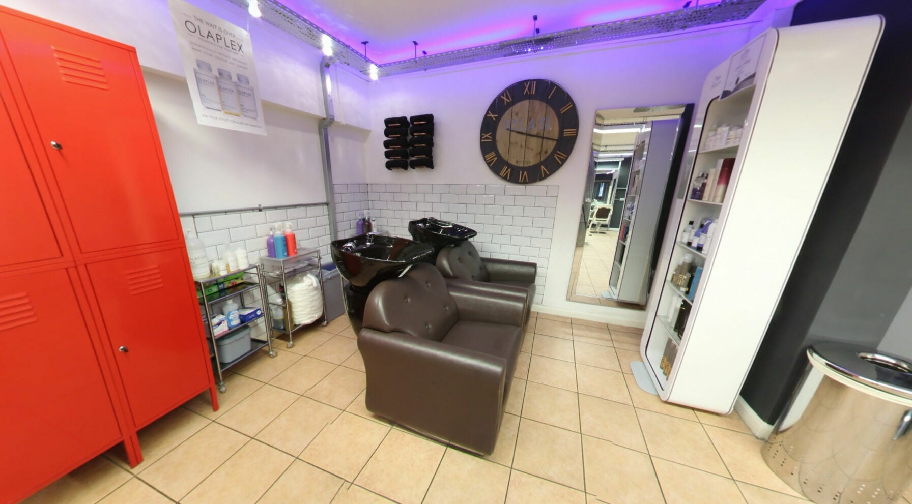 Modern hair washing station at Vo La Si, Guisborough, England, GB with sleek chairs and ambient lighting.