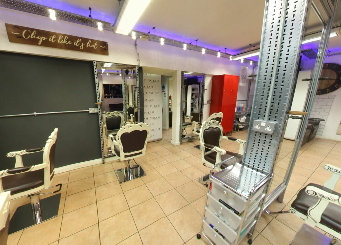 Elegant salon interior at Vo La Si, Guisborough, England, GB featuring vintage chairs and stylish mirrors.