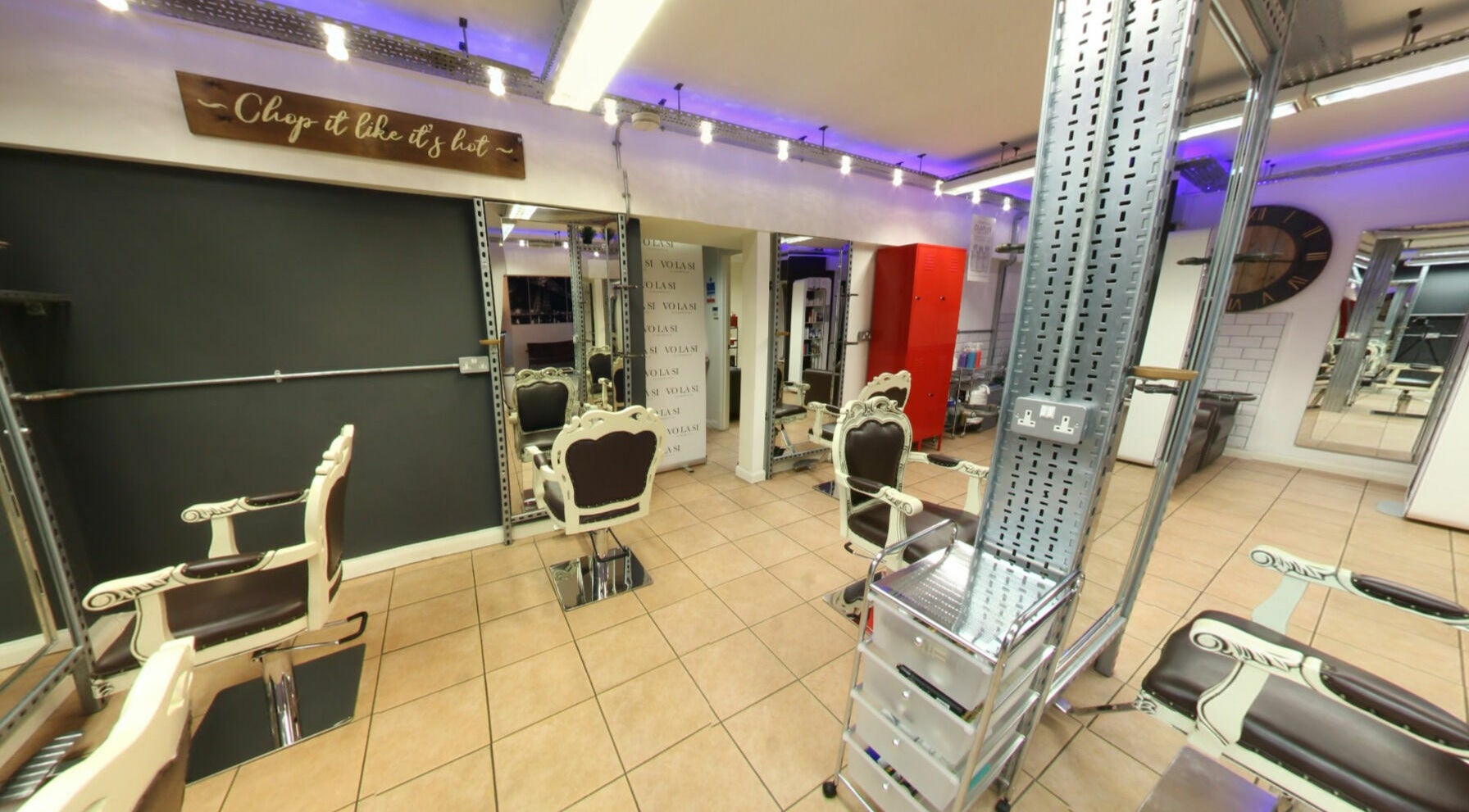 Elegant salon interior at Vo La Si, Guisborough, England, GB featuring vintage chairs and stylish mirrors.