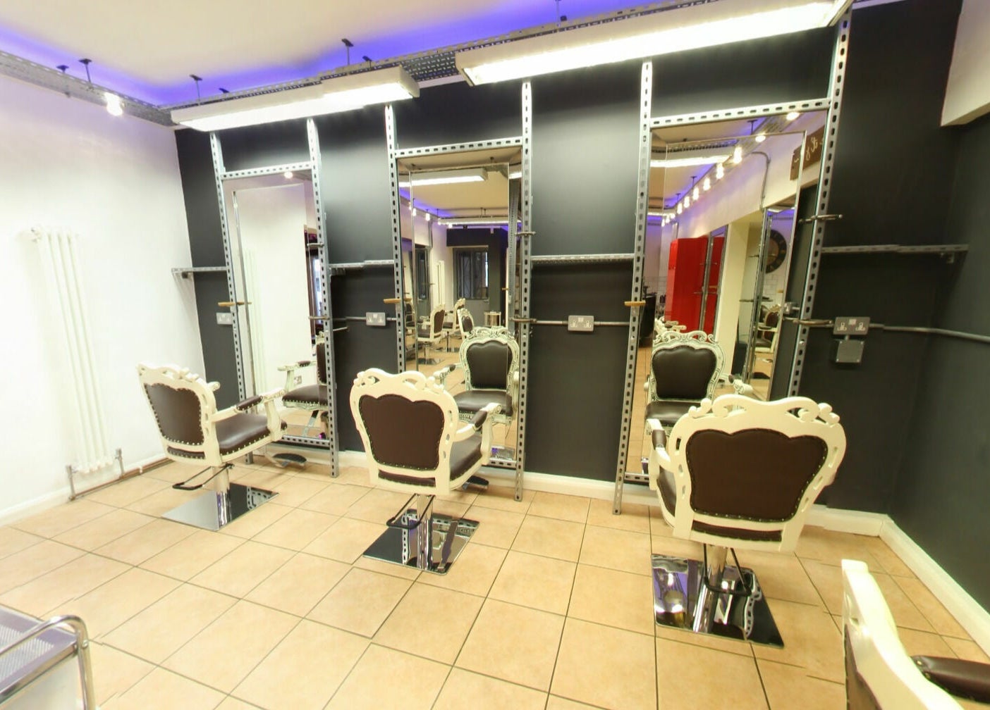 Chic salon interior with stylish chairs at Vo La Si, Guisborough, England, GB.