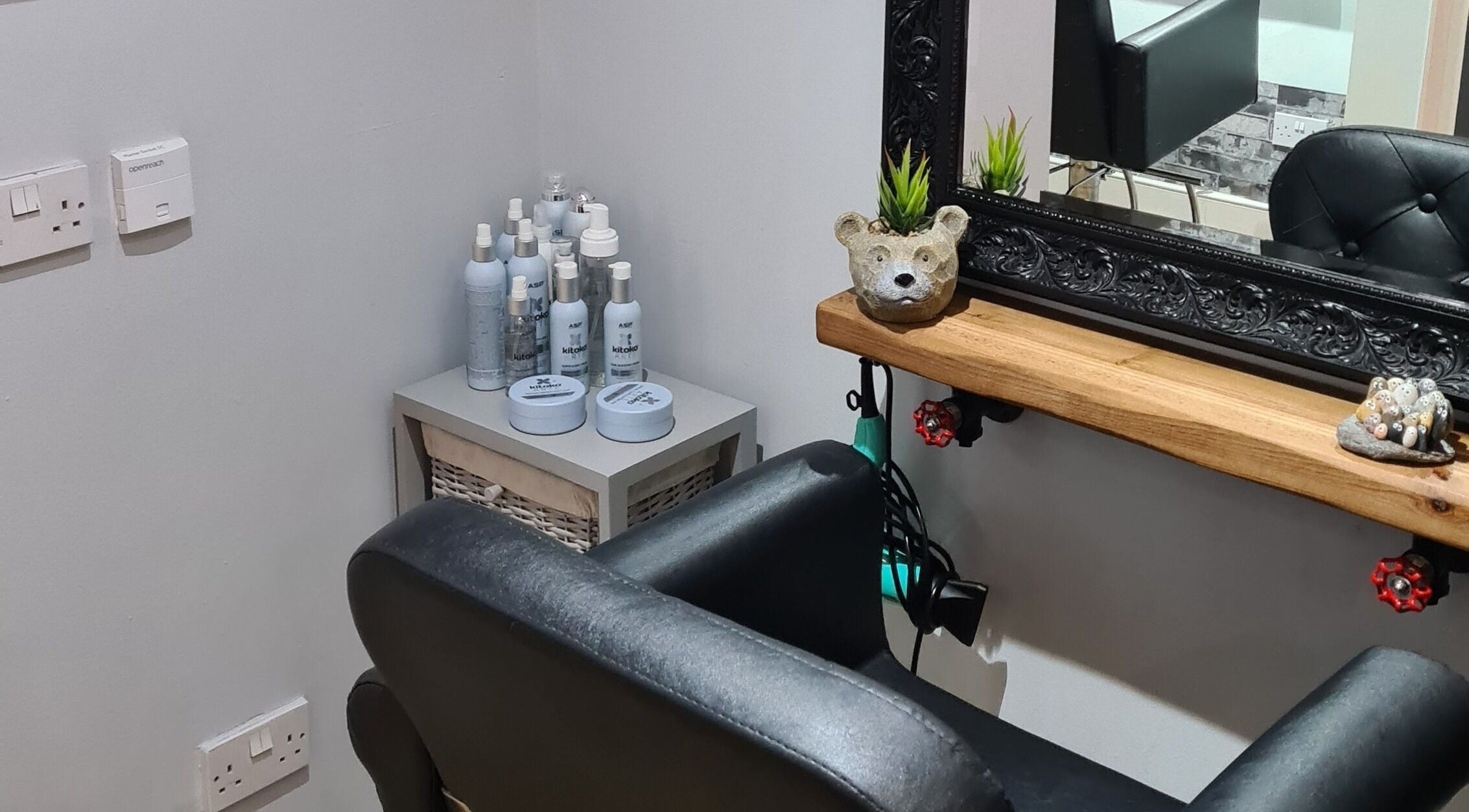 Cozy corner at Alter Ego with grooming products and plush seating in Worcester, England, GB.