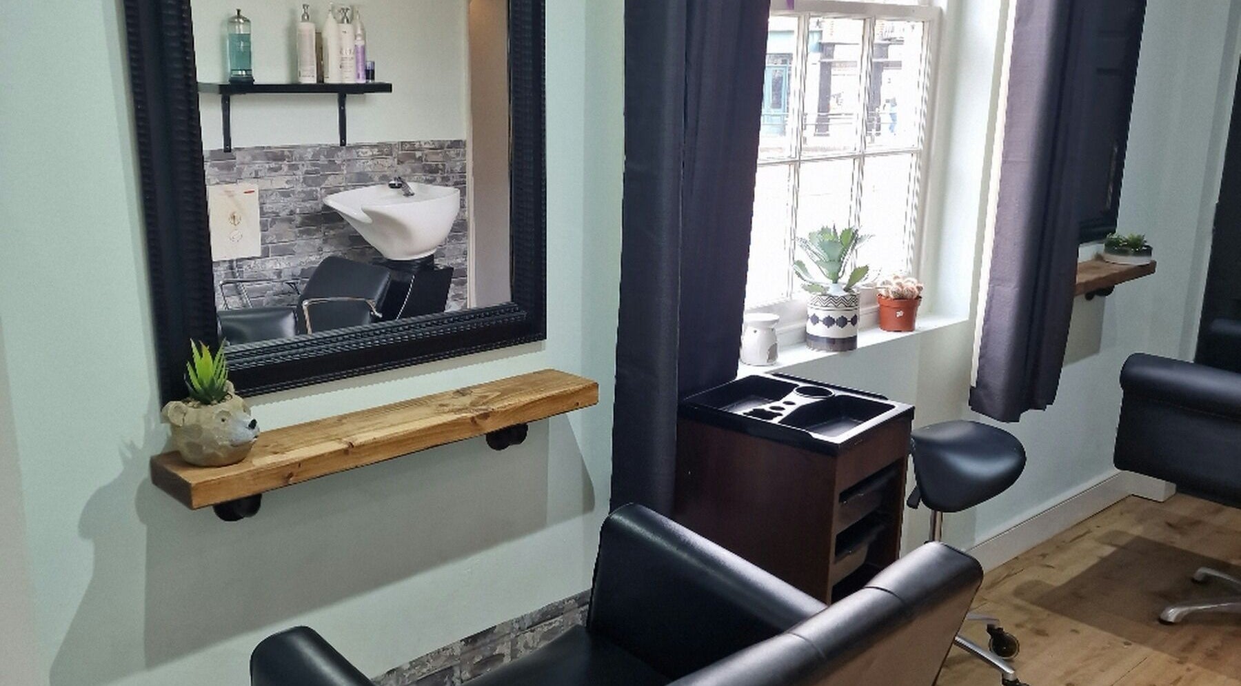 Elegant salon space at Alter Ego, Worcester, England, GB with modern decor and natural lighting.