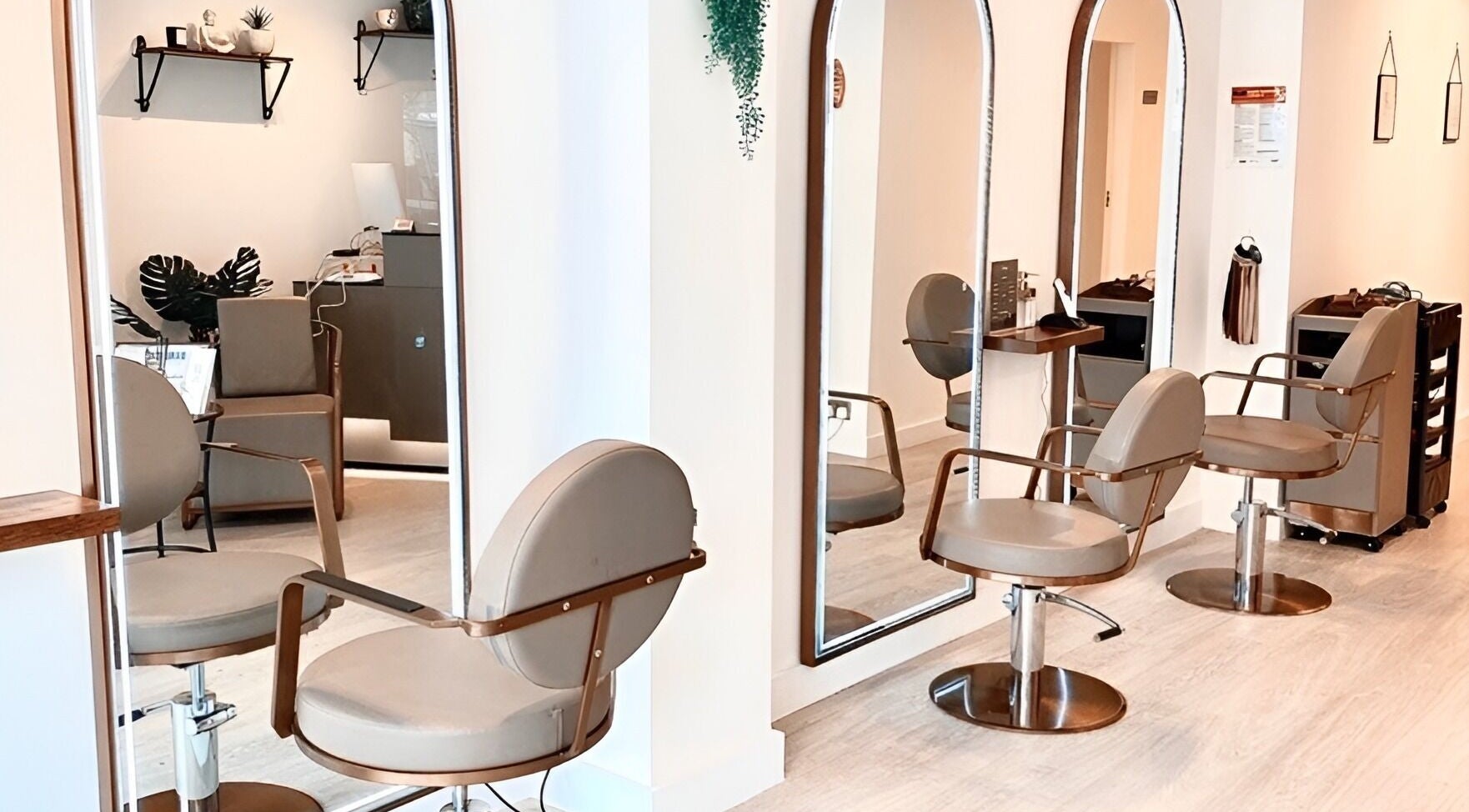 Stylish seating and mirrors at Becca Hair and Beauty Salon, Barnet, England, GB for a luxurious experience.