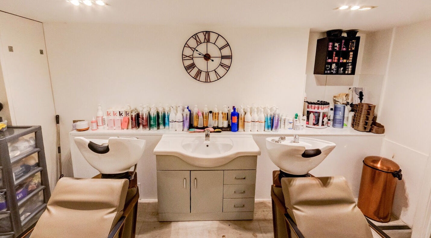 Modern salon wash stations at Becca Hair and Beauty Salon, Barnet, England, GB; stylish and inviting setting.