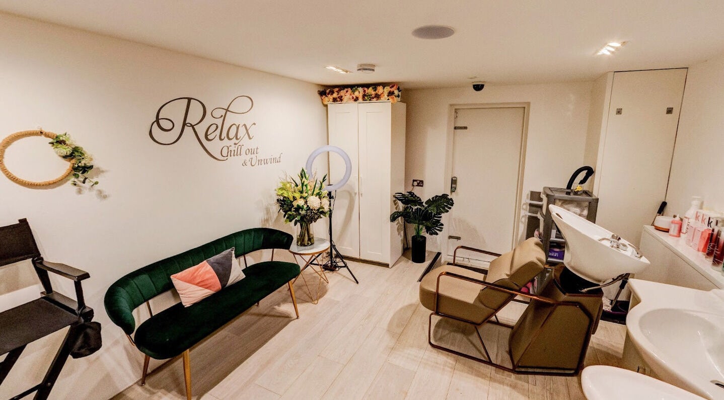 Becca Hair and Beauty Salon's stylish interior in Barnet, England, GB: lush seating and ornate wall decor.