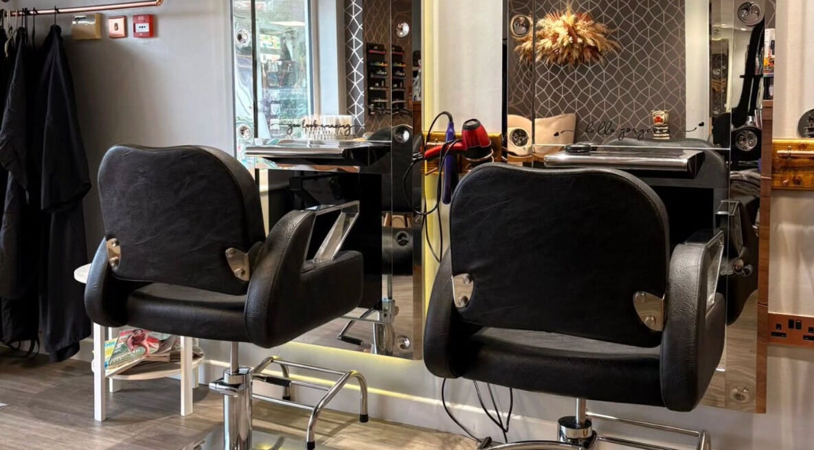 Elegant salon chairs at Embrace Hair & Beauty, Breaston, England, GB, showcasing modern styling stations.