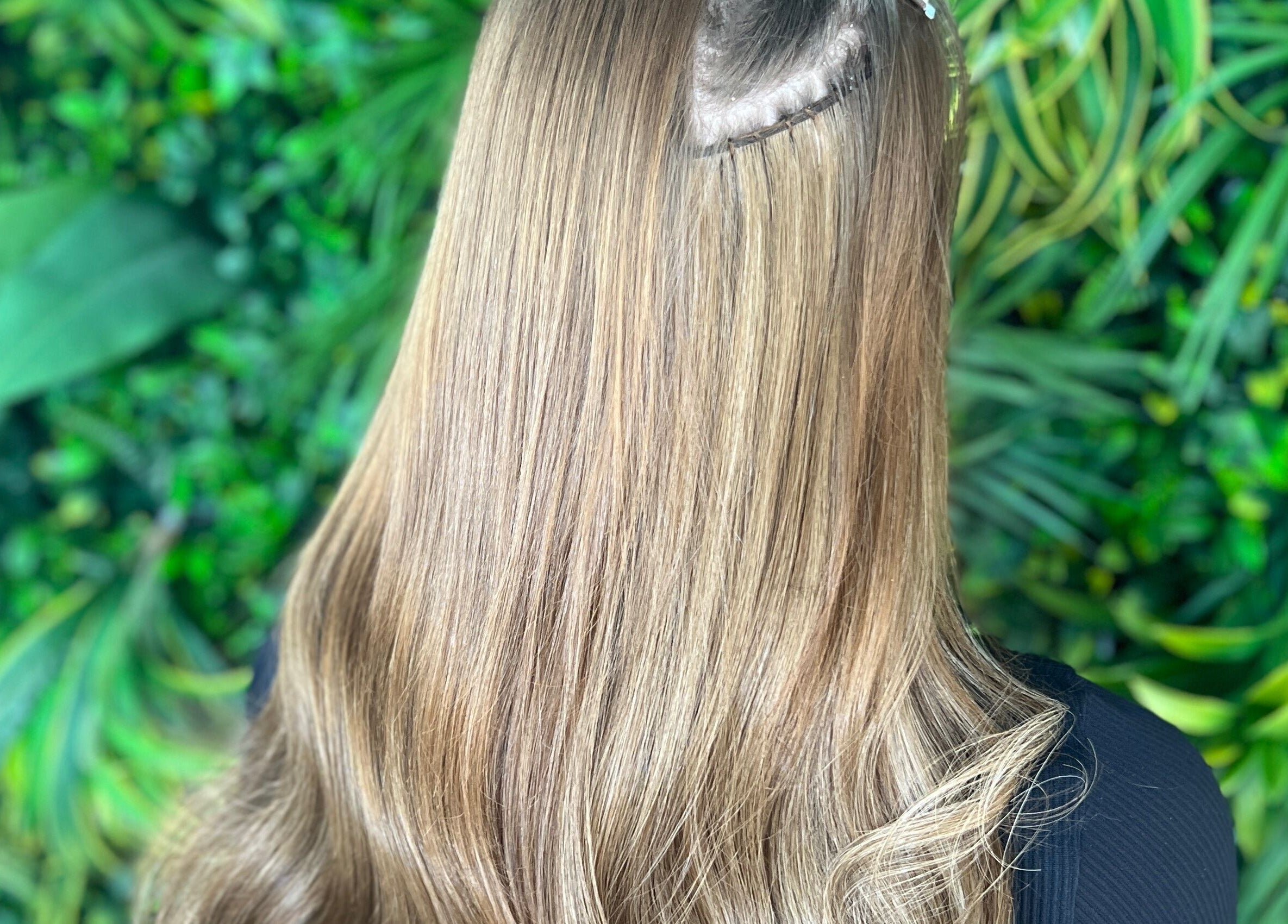 Sleek, long hair with vibrant green backdrop at Lengths | By CJP, Writtle, England, GB.