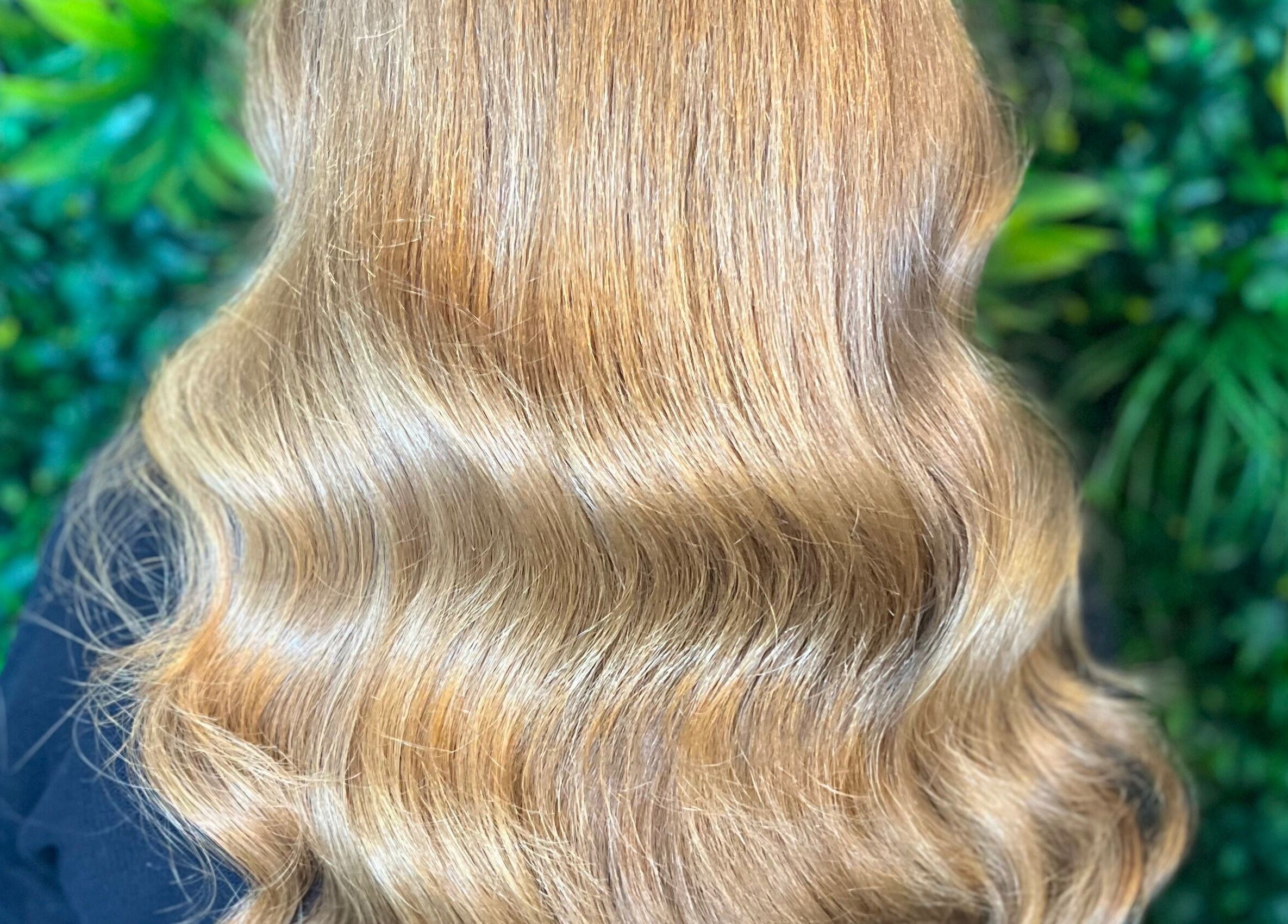 Elegant blonde waves at Lengths | By CJP in Writtle, England, GB, set against a lush green backdrop.