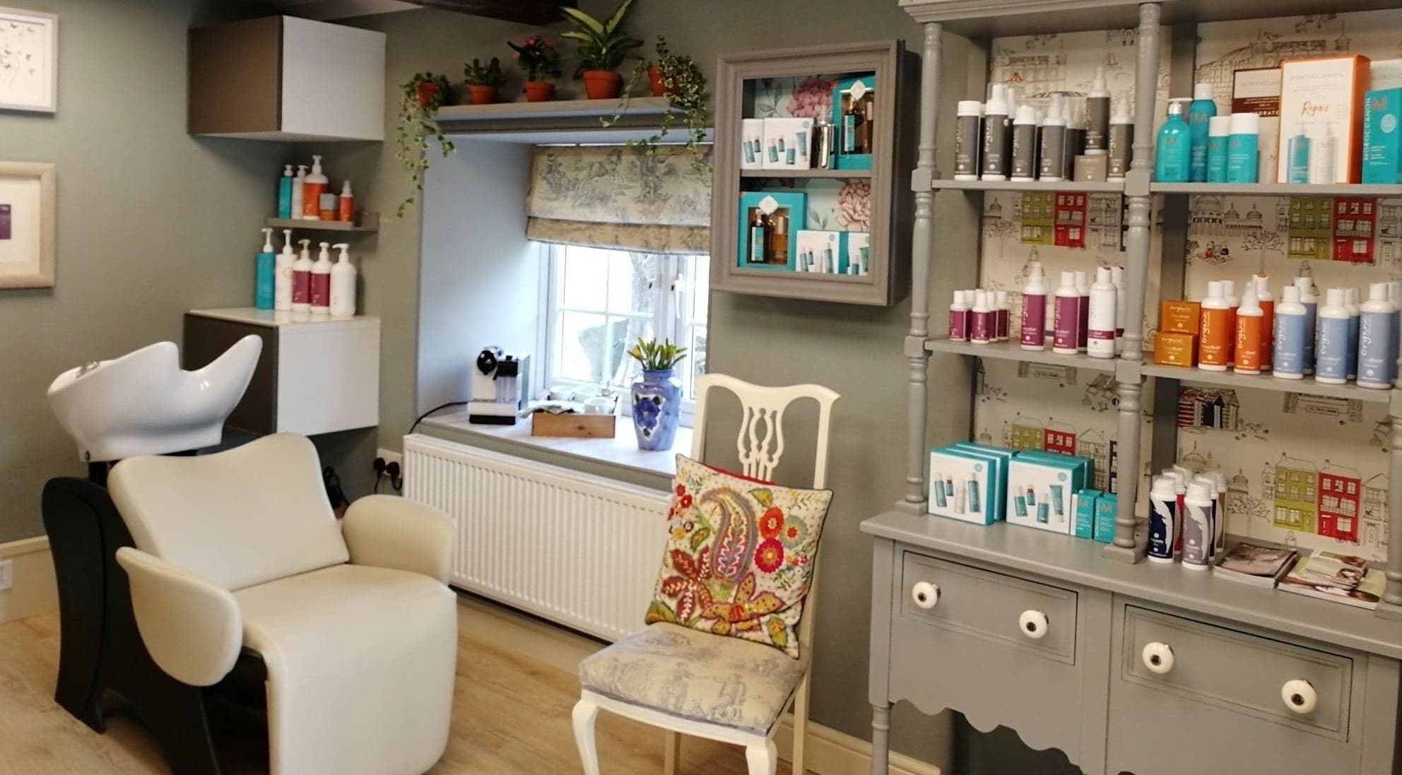 Chic interior of Melaine Salon in Helston, England, GB with stylish decor and beauty products.
