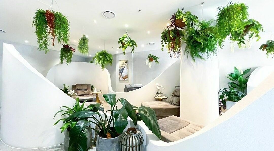 Relaxing lounge with lush greenery at Lan Spa in Surfers Paradise, Queensland, AU.