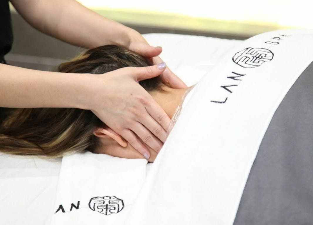Relaxing neck massage at Lan Spa, Surfers Paradise, Queensland, AU. Experience serene wellness in a calming environment.