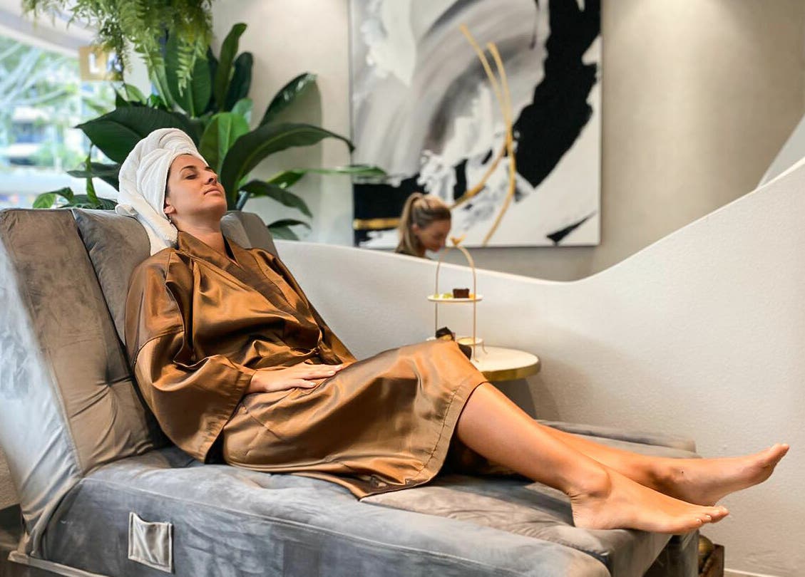 A serene guest relaxes in a robe at Lan Spa, Surfers Paradise, Queensland, AU.