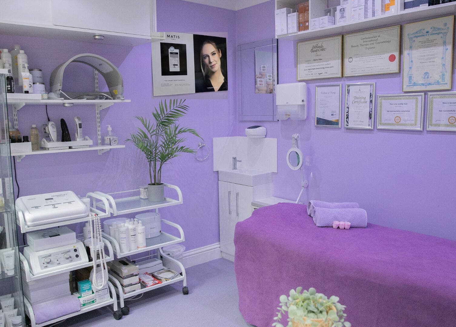 Relaxing treatment room at Pamper Parlour, Coulsdon, England, GB; features lavender decor and beauty equipment.