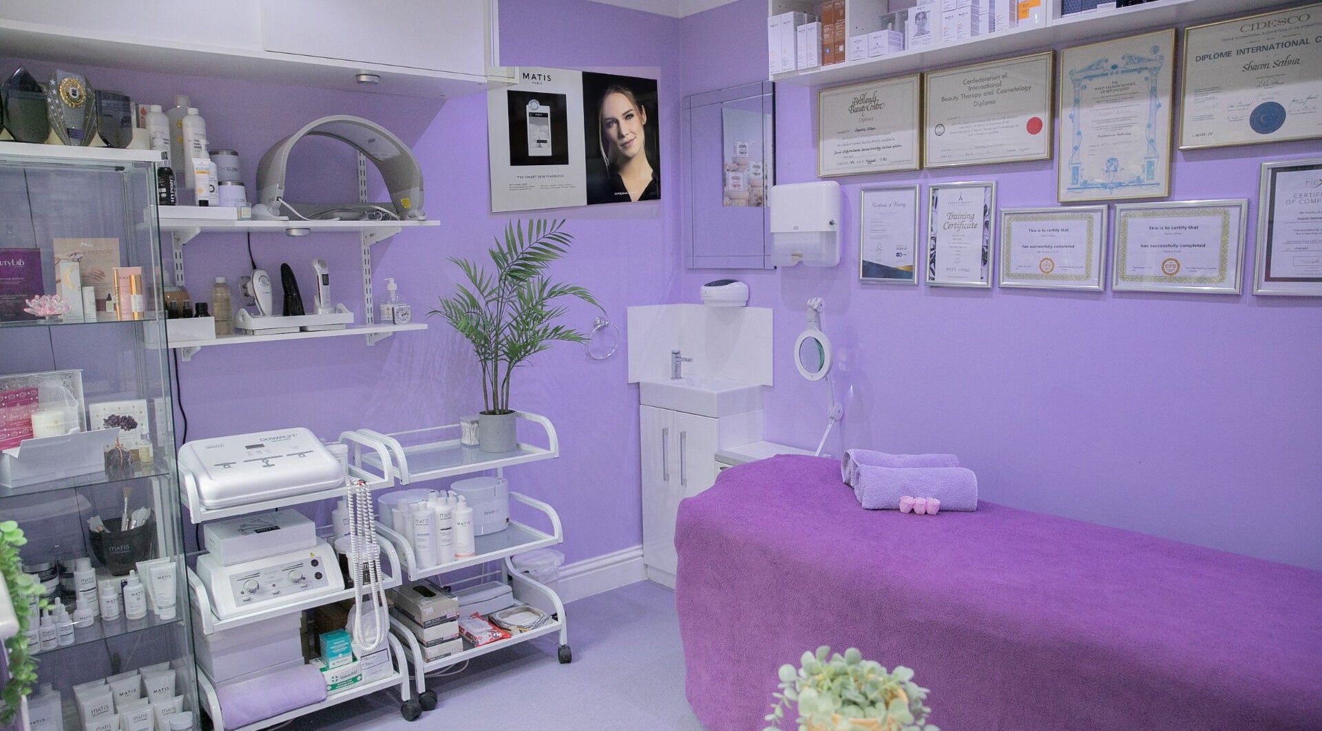 Relaxing treatment room at Pamper Parlour, Coulsdon, England, GB; features lavender decor and beauty equipment.