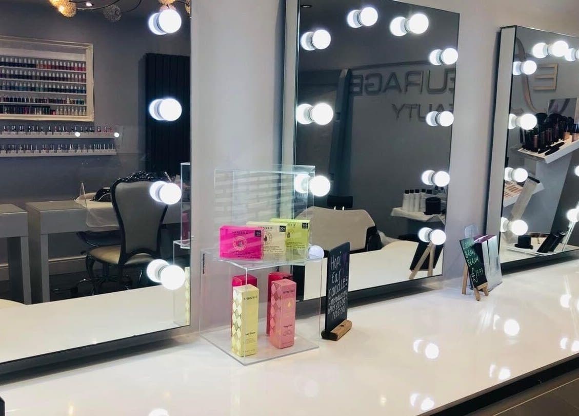 Effleurage Hair and Beauty Limited salon station with lit mirrors in Langley Mill, England, GB.