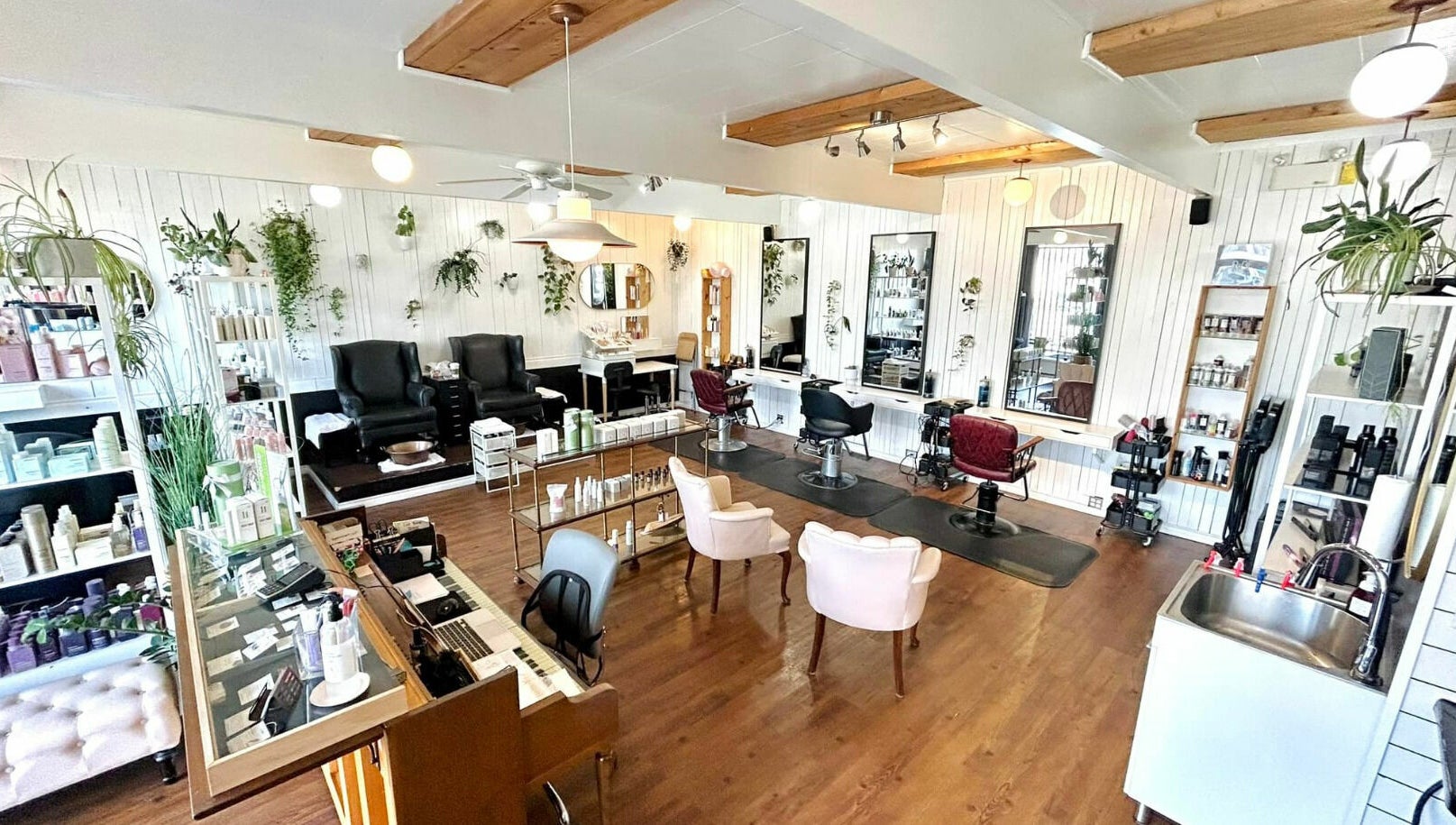 Interior of Darling and Dapper Salon and Spa in Abbotsford, British Columbia, CA, featuring elegant styling stations.