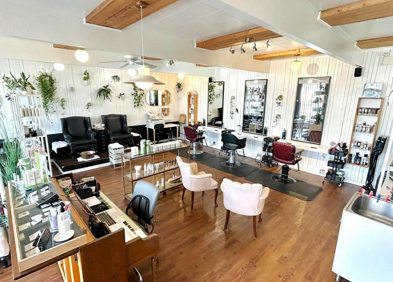 Interior of Darling and Dapper Salon and Spa in Abbotsford, British Columbia, CA, featuring elegant styling stations.