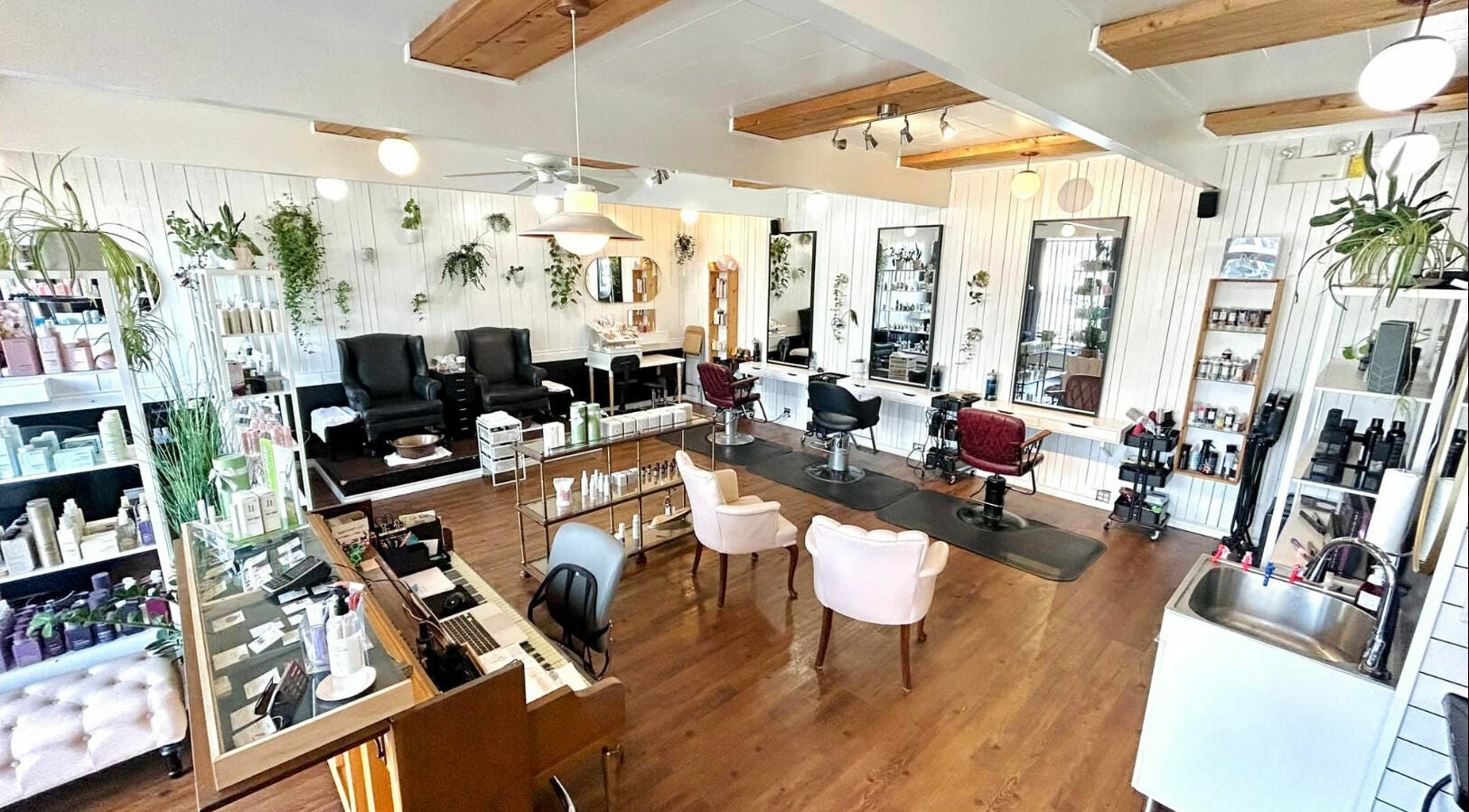 Interior of Darling and Dapper Salon and Spa in Abbotsford, British Columbia, CA, featuring elegant styling stations.