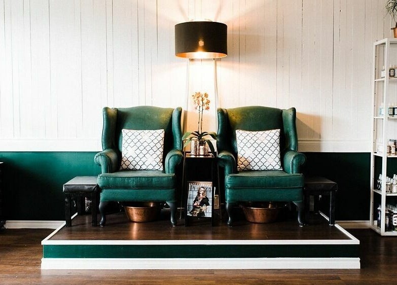 Luxurious green chairs in tranquil setting at Darling and Dapper Salon and Spa, Abbotsford, British Columbia, CA.