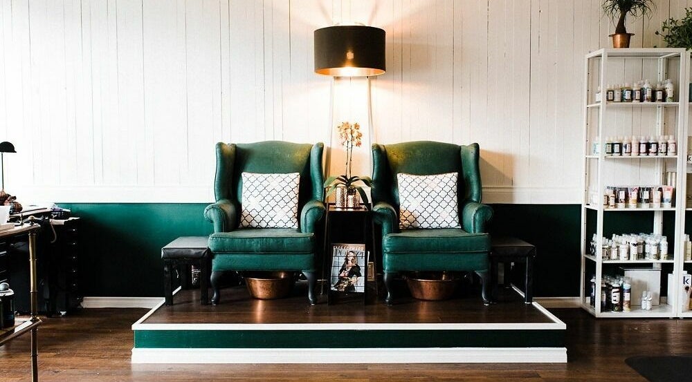 Luxurious green chairs in tranquil setting at Darling and Dapper Salon and Spa, Abbotsford, British Columbia, CA.