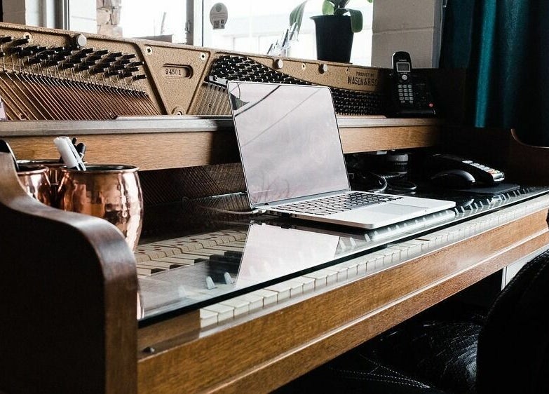 Chic reception at Darling and Dapper Salon and Spa, Abbotsford, British Columbia, CA with a laptop and copper mug.
