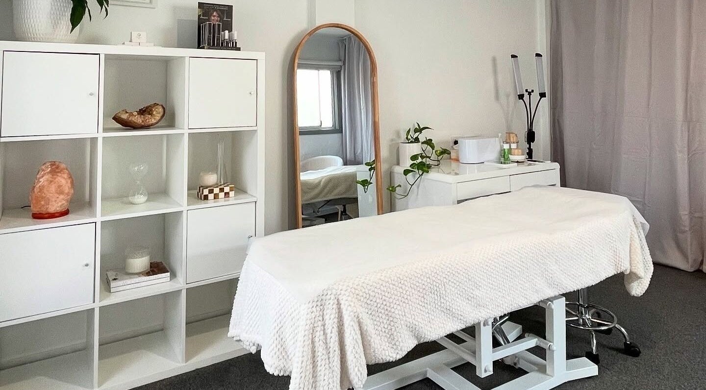 Calming treatment room at Renn Beauty, Melbourne, Victoria, AU with a white massage table and elegant decor.