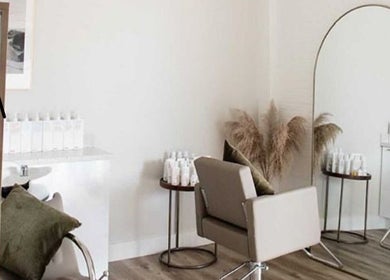 Modern salon space at Her Wellness Space, Biggera Waters, Queensland, AU. Stylish decor and hair products visible.
