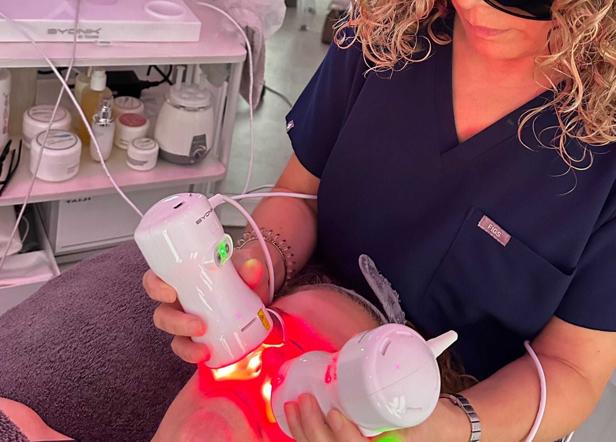 Technician performs laser facial treatment at Nu-Yu Advanced Skin Solutions, Sidcup, England, GB.