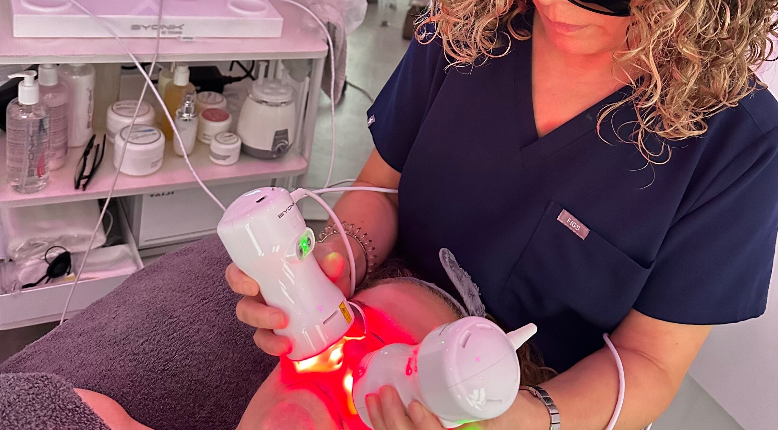 Technician performs laser facial treatment at Nu-Yu Advanced Skin Solutions, Sidcup, England, GB.