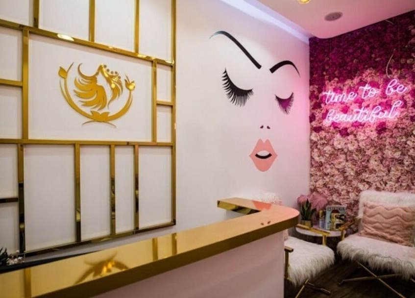Touq AlYasmeen Ladies Salon in Sharjah offers a chic interior with floral decor and golden accents.