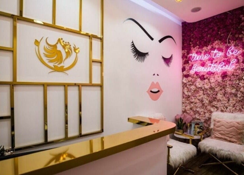 Touq AlYasmeen Ladies Salon in Sharjah offers a chic interior with floral decor and golden accents.