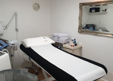 Modern treatment room at Wioletta Beauty - Fulham, London, England, GB with advanced spa equipment.