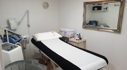 Modern treatment room at Wioletta Beauty - Fulham, London, England, GB with advanced spa equipment.